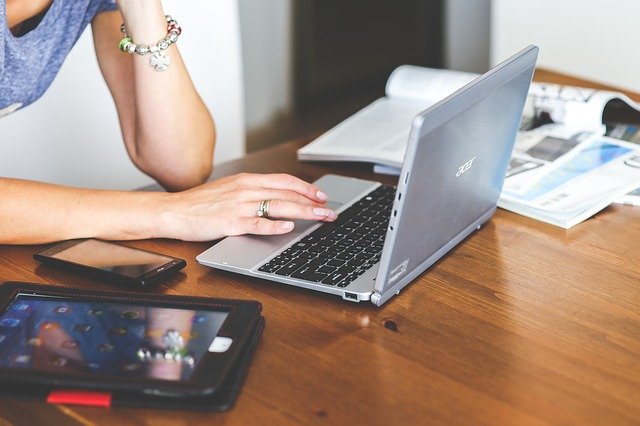 An image of a laptop, tablet, and phone being used for work. Risks for law firm mobile devices need to be addressed to keep data secure. Is your laptop, tablet and phone safe?