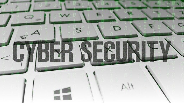 Image of the word “cyber security” over a keyboard, representing the need for encryption for small business to protect against digital security risks.