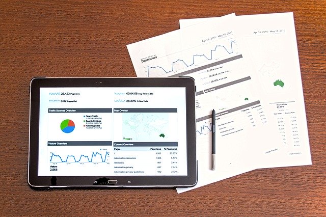 Image of a tablet and website statistics, representing how data analytics in law firms are used.