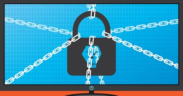 Illustration of a lock with chains attached to it on a computer screen with dollar signs in the background, representing what SMBs need to know about ransomware is that it is a very real crime that needs to be addressed before it happens or the consequences could be severe.